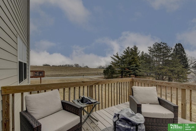 wooden terrace with a rural view