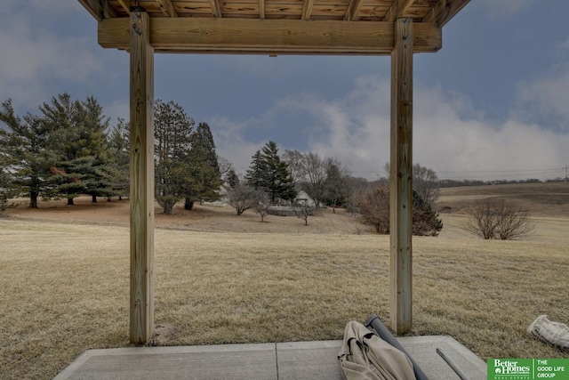 view of yard with a rural view