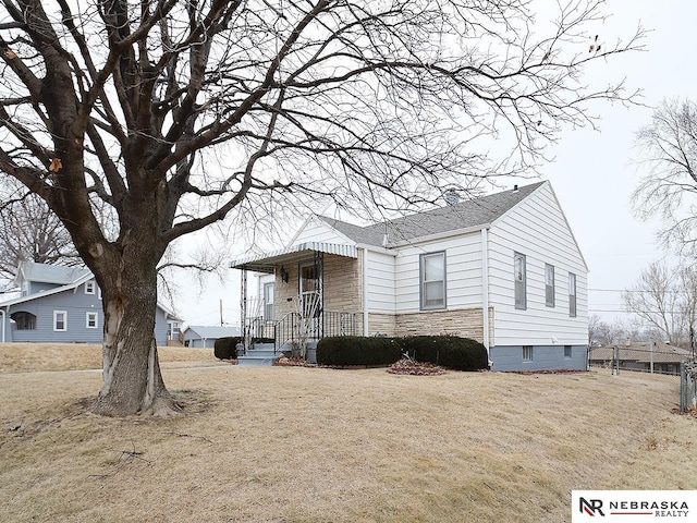 view of property exterior featuring a lawn