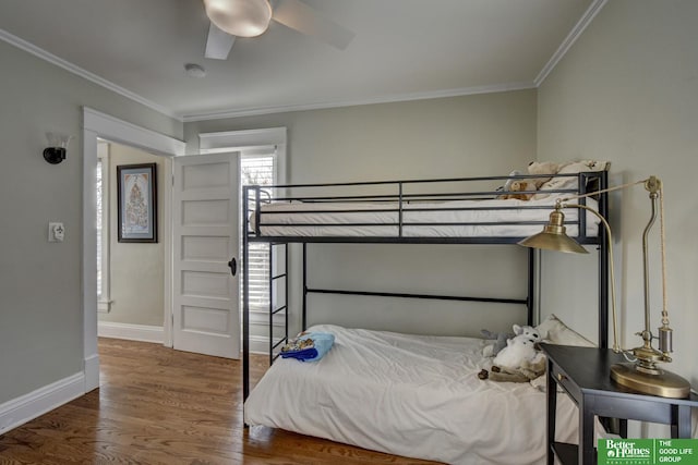 bedroom with ornamental molding, dark hardwood / wood-style floors, and ceiling fan