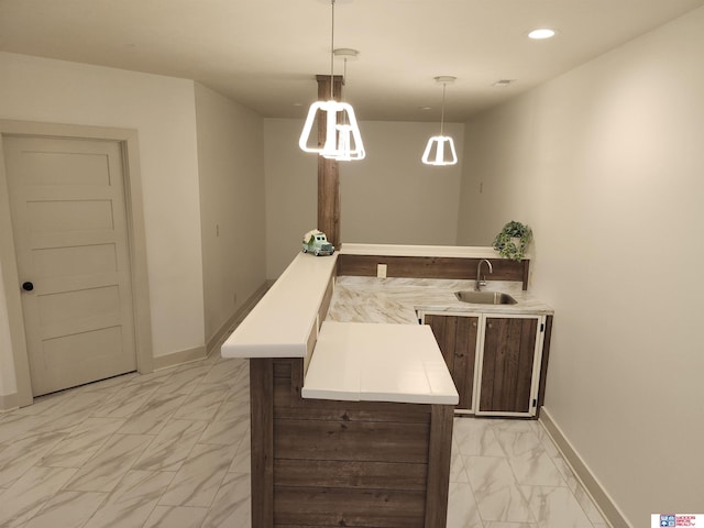 bar with sink and decorative light fixtures