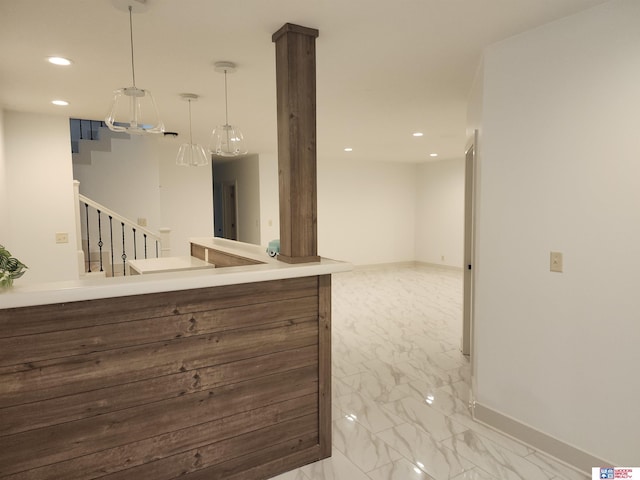 kitchen with decorative light fixtures and kitchen peninsula