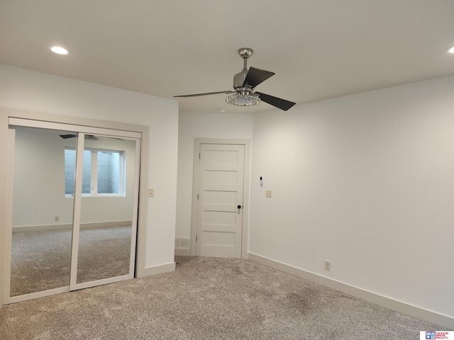 unfurnished bedroom with carpet and ceiling fan