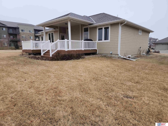 view of front of home featuring a front lawn and a porch