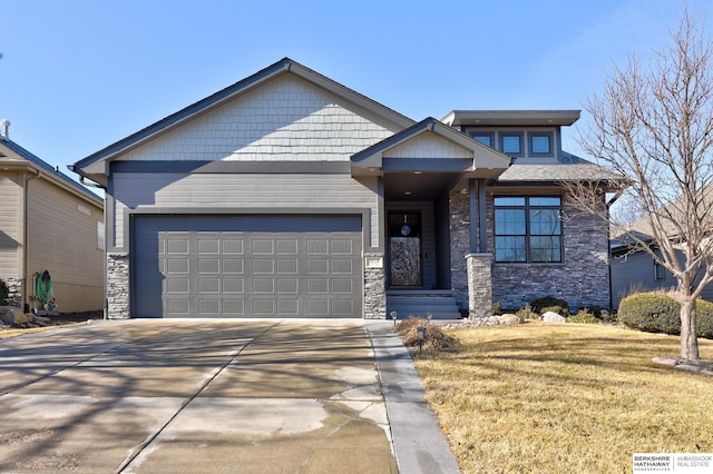 view of front of house with a garage and a front lawn