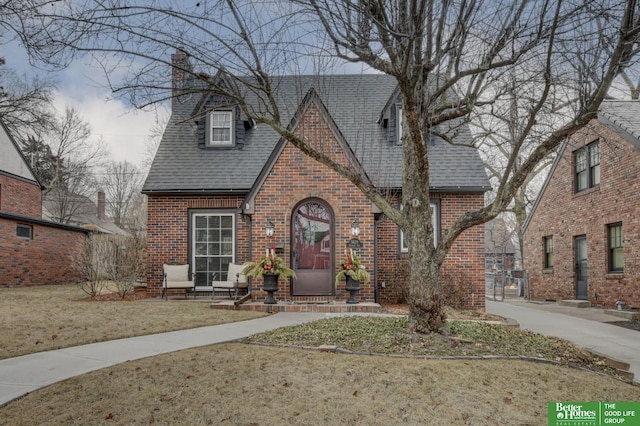 tudor house with a front lawn