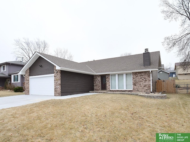 single story home featuring a garage and a front yard