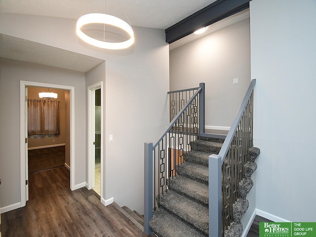 staircase featuring hardwood / wood-style flooring