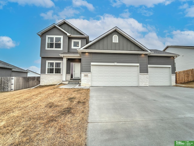 view of front of property with a garage and a front yard