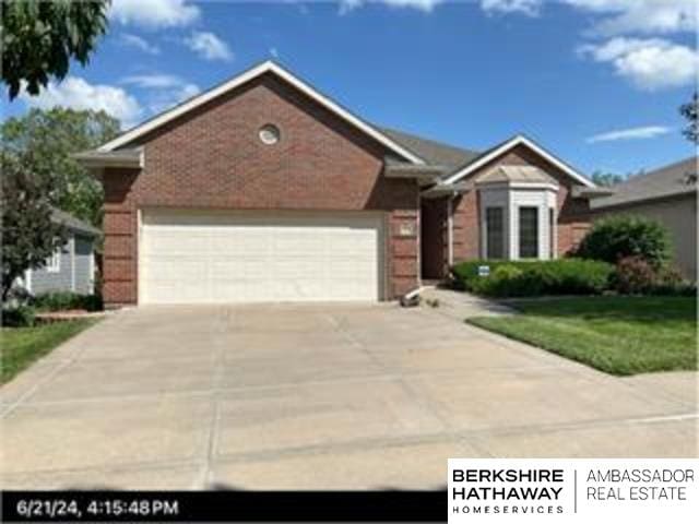 single story home featuring a garage