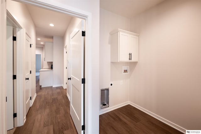 clothes washing area featuring cabinets, washer hookup, hookup for an electric dryer, and dark hardwood / wood-style flooring