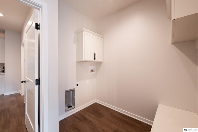 washroom with washer hookup, electric dryer hookup, cabinets, and dark hardwood / wood-style floors