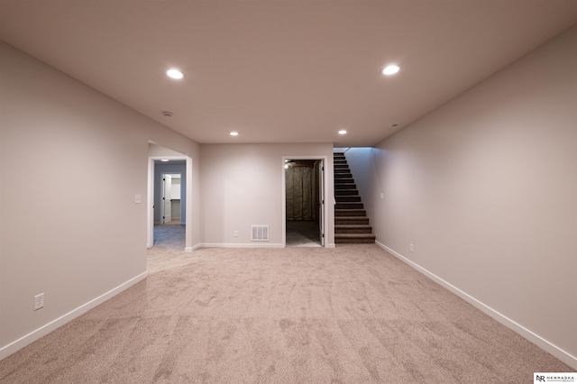 unfurnished living room with light carpet