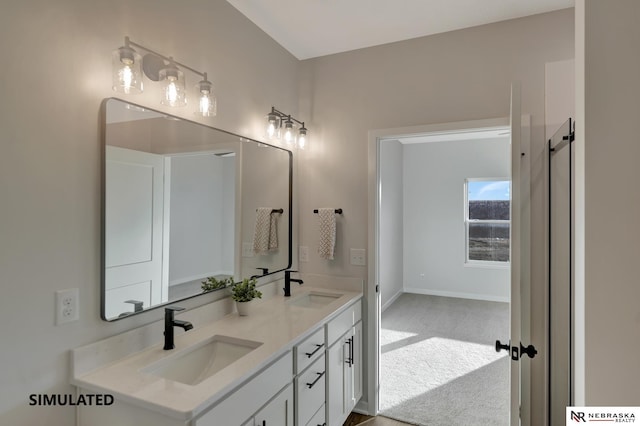 full bathroom featuring a sink, baseboards, and double vanity