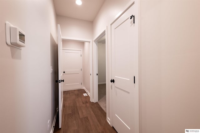 hall with dark hardwood / wood-style floors