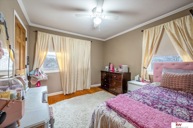 bedroom featuring ceiling fan, ornamental molding, and light hardwood / wood-style floors