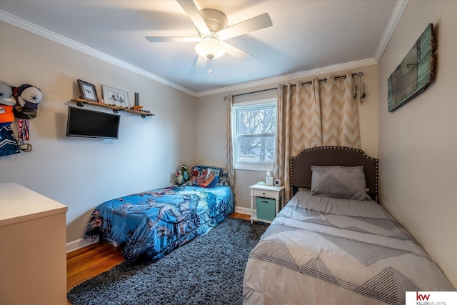 bedroom with dark hardwood / wood-style flooring, ornamental molding, and ceiling fan