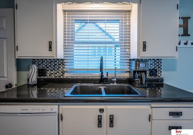 kitchen featuring white cabinetry, white dishwasher, sink, and backsplash