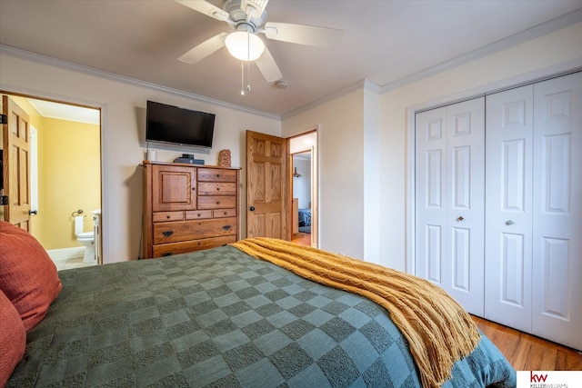 bedroom featuring connected bathroom, crown molding, a closet, hardwood / wood-style flooring, and ceiling fan