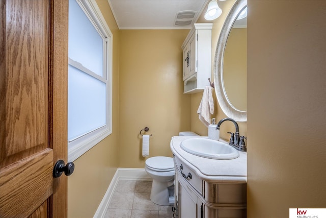 bathroom with ornamental molding, tile patterned floors, toilet, and vanity