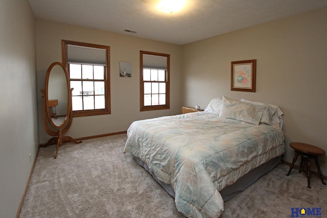 bedroom with light carpet