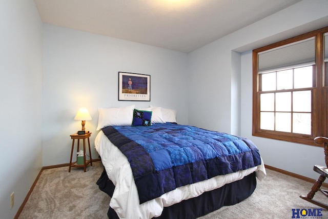 bedroom featuring light carpet