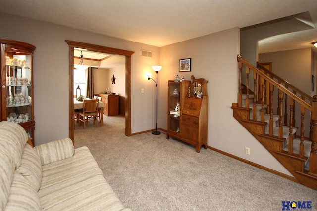 living room featuring light carpet