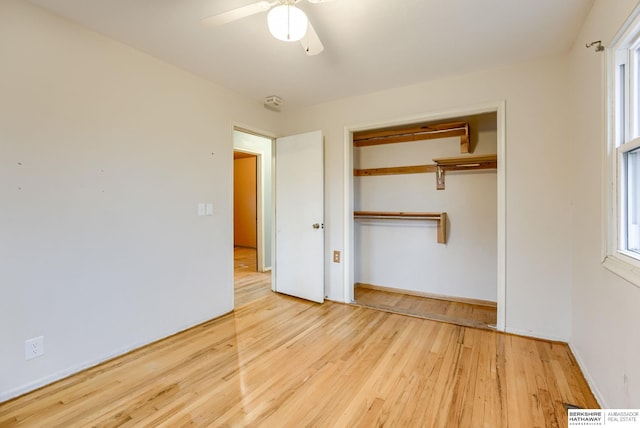 unfurnished bedroom with ceiling fan, light hardwood / wood-style floors, and a closet