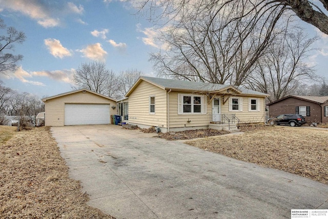 single story home with an outbuilding and a garage