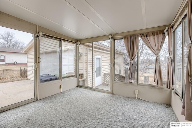 unfurnished sunroom featuring a wealth of natural light