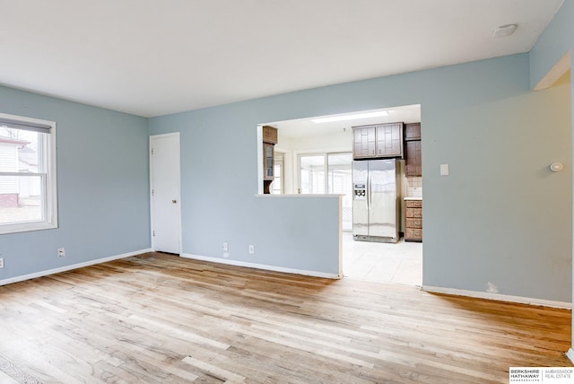 spare room with light wood-type flooring