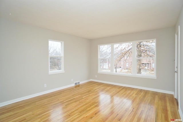 unfurnished room featuring light hardwood / wood-style floors