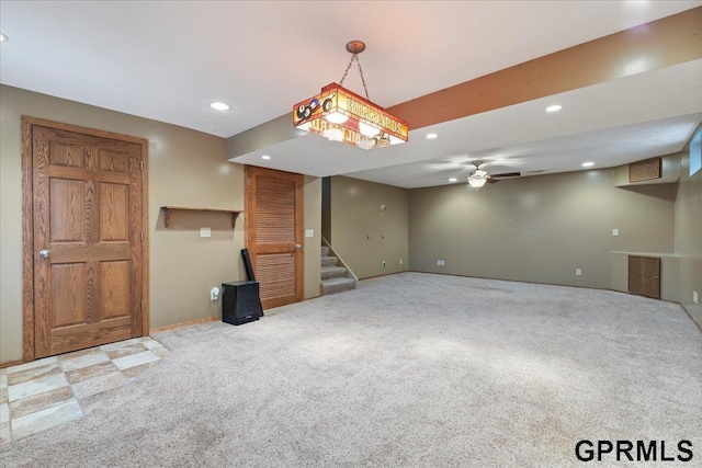 interior space featuring ceiling fan and carpet flooring