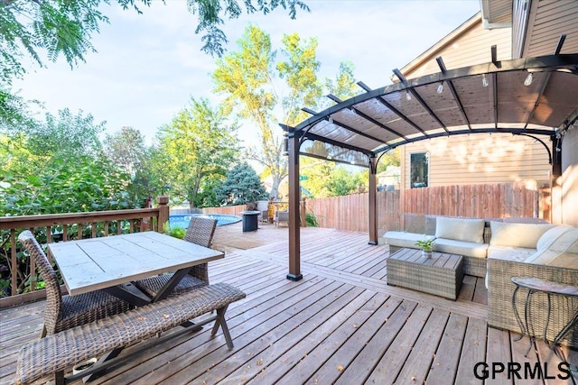 deck featuring outdoor lounge area and a pergola