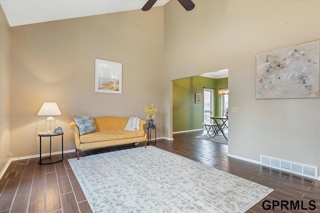 living room featuring high vaulted ceiling and ceiling fan