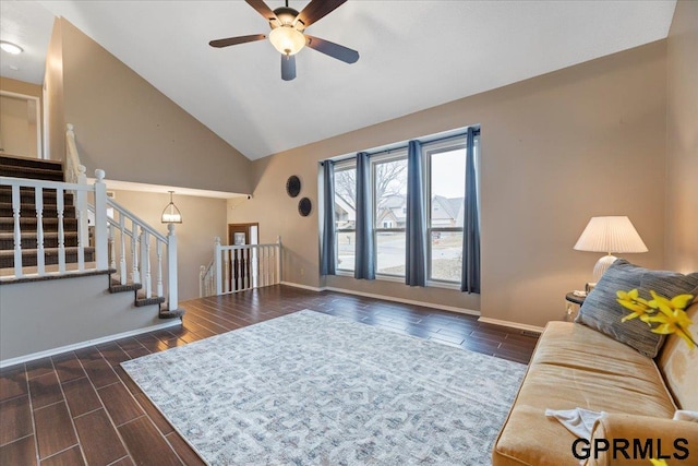 living room featuring ceiling fan and vaulted ceiling