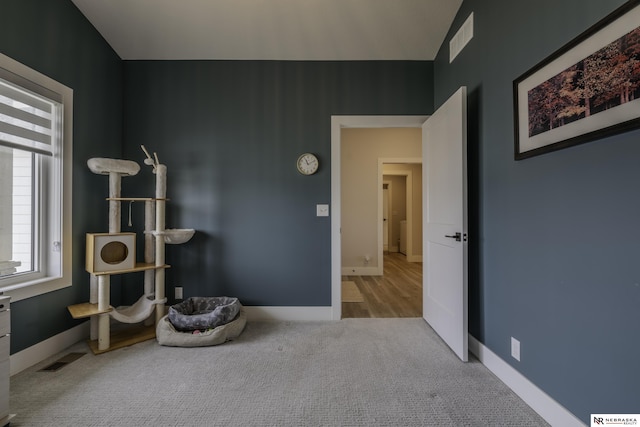 interior space featuring light colored carpet