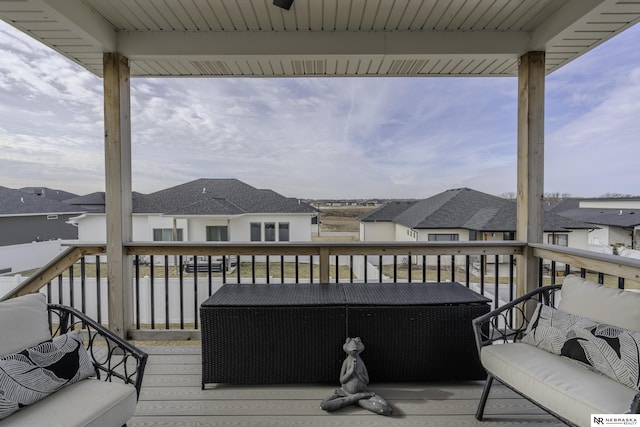 deck with ceiling fan and an outdoor hangout area