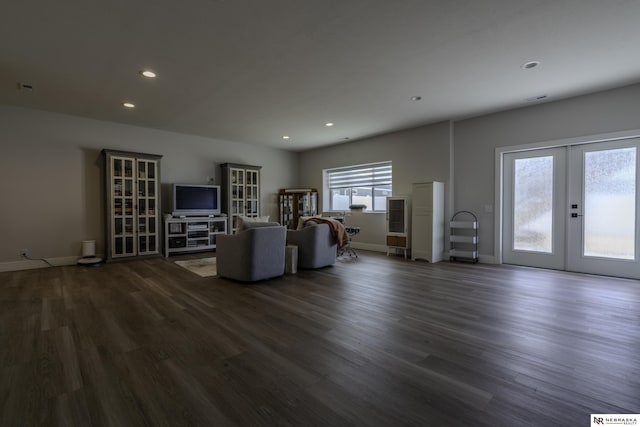 unfurnished living room with french doors and dark wood-type flooring