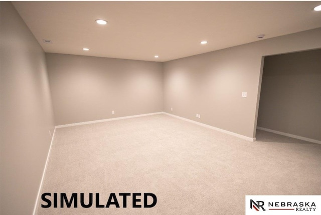 unfurnished room featuring light carpet