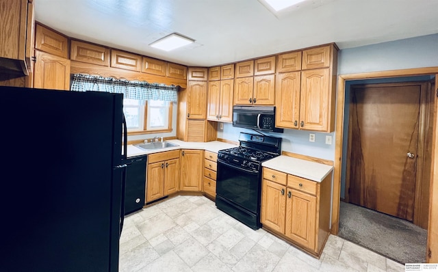 kitchen featuring sink and black appliances