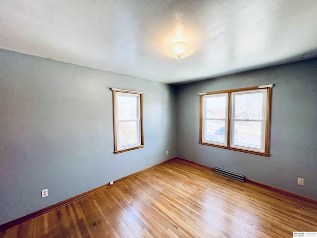 spare room with light wood-type flooring