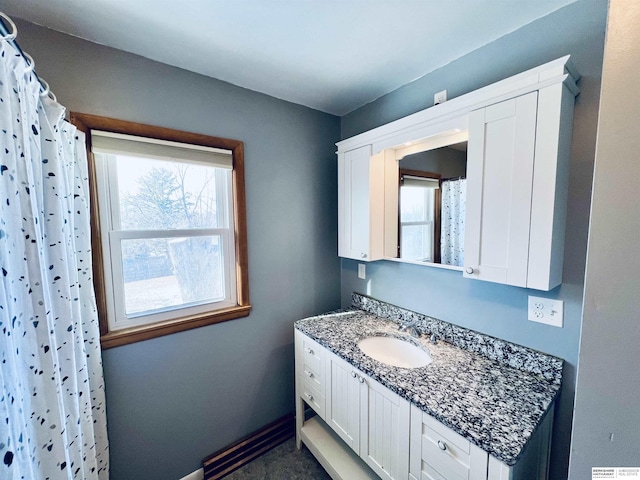 bathroom featuring vanity and a shower with curtain