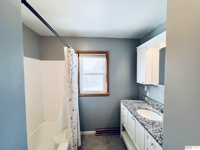 bathroom featuring vanity and shower / bath combo