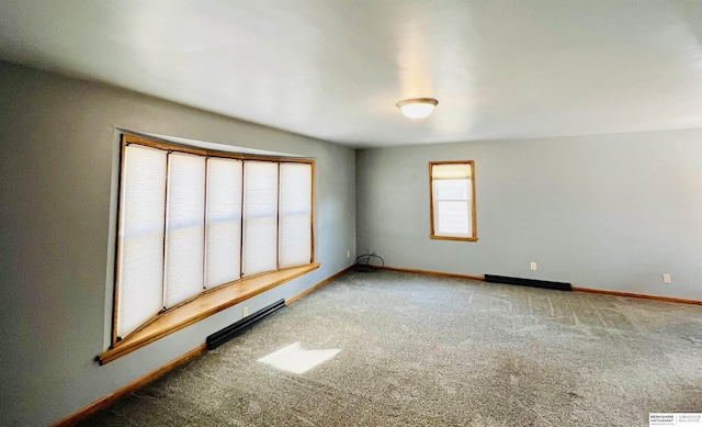 unfurnished room featuring carpet