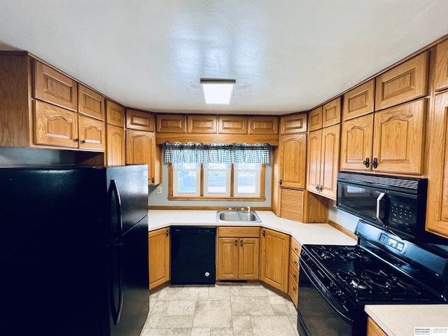 kitchen featuring sink and black appliances