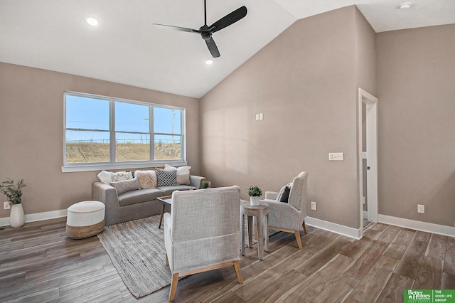 living room with dark wood-type flooring, high vaulted ceiling, and ceiling fan