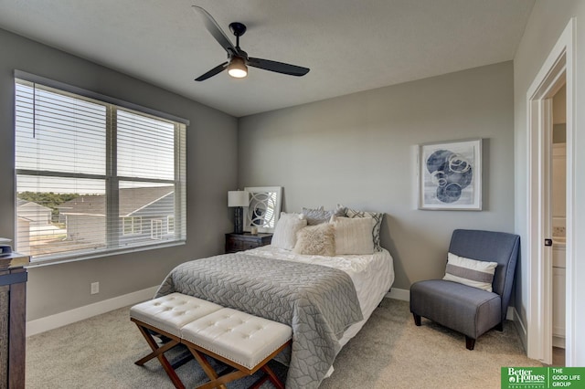 bedroom featuring light carpet and ceiling fan