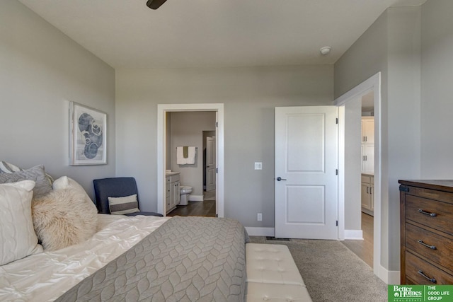 carpeted bedroom with ensuite bath