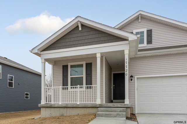 view of front of house featuring a garage and covered porch